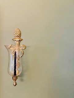 a wall light with a pineapple on the top of it