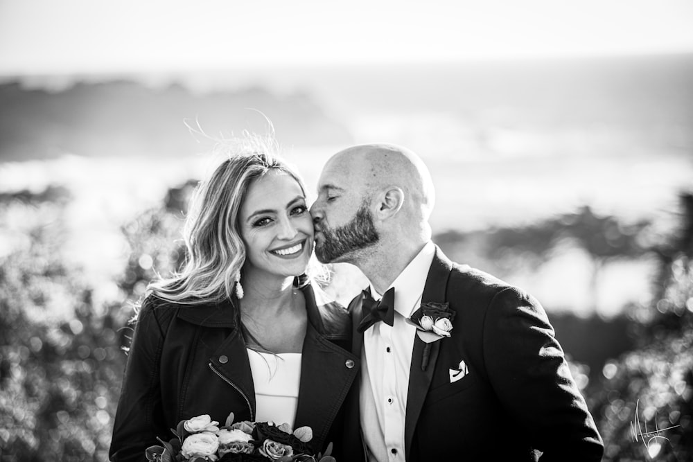 a man and a woman standing next to each other