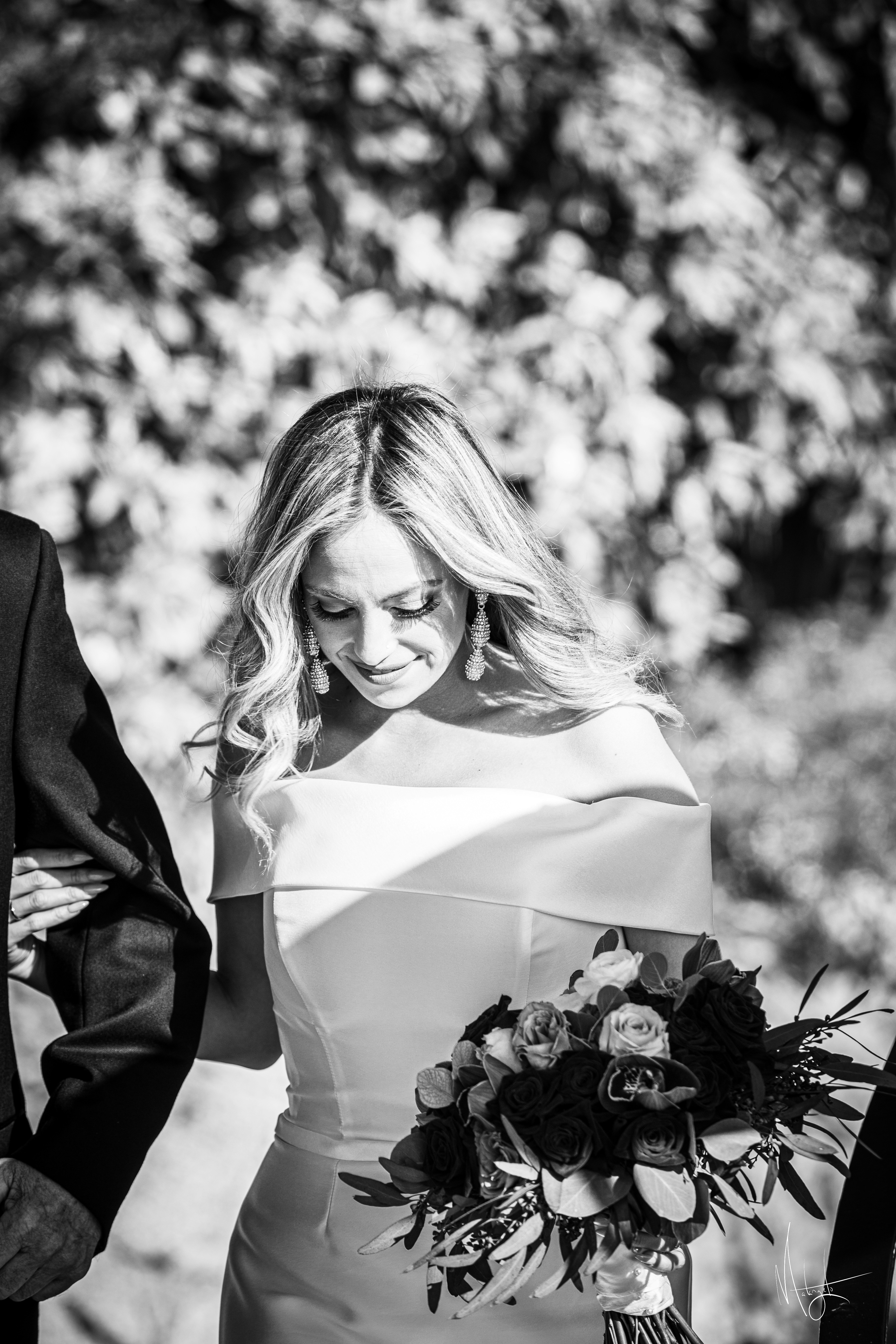 a bride and groom walking down the aisle
