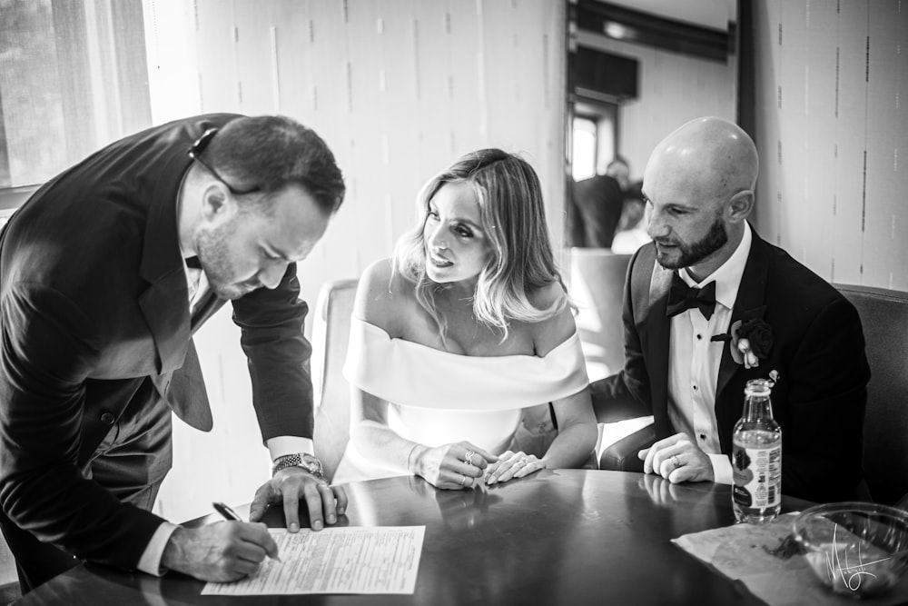 a couple of people that are sitting at a table