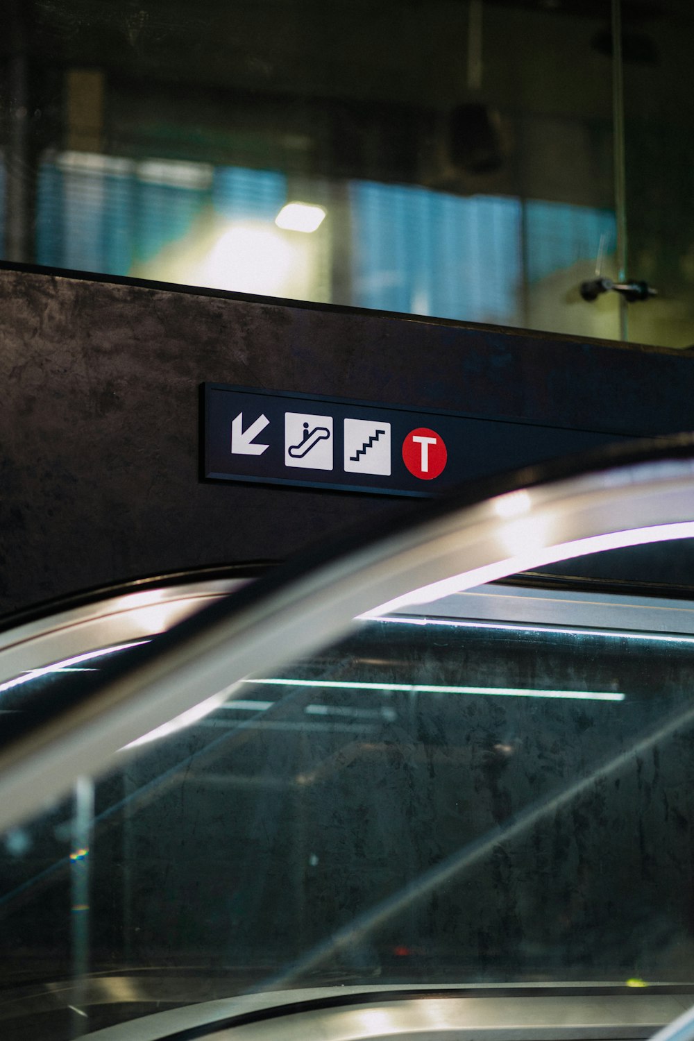 a close up of a sign on an escalator