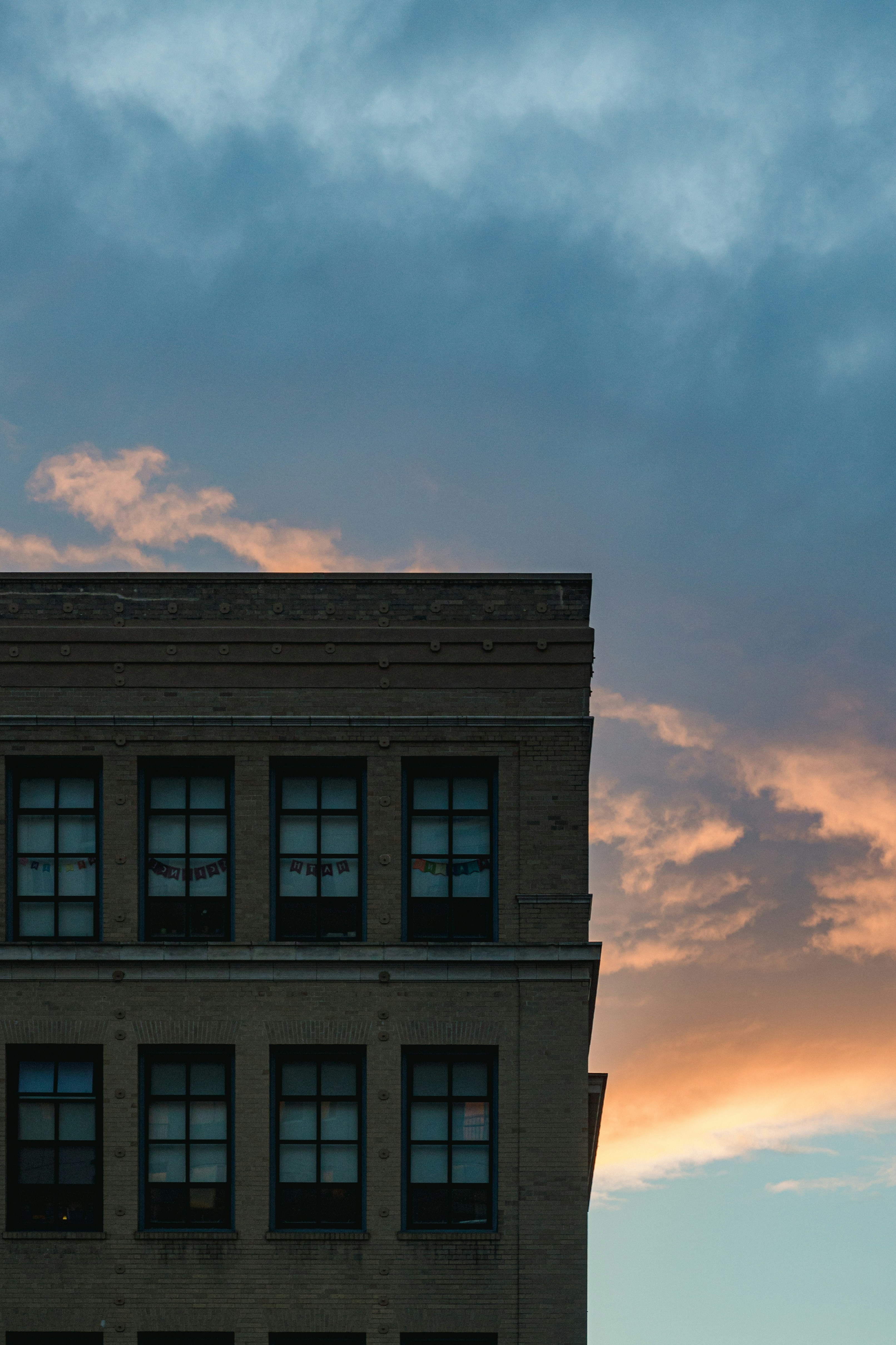 a tall building with a clock on the top of it