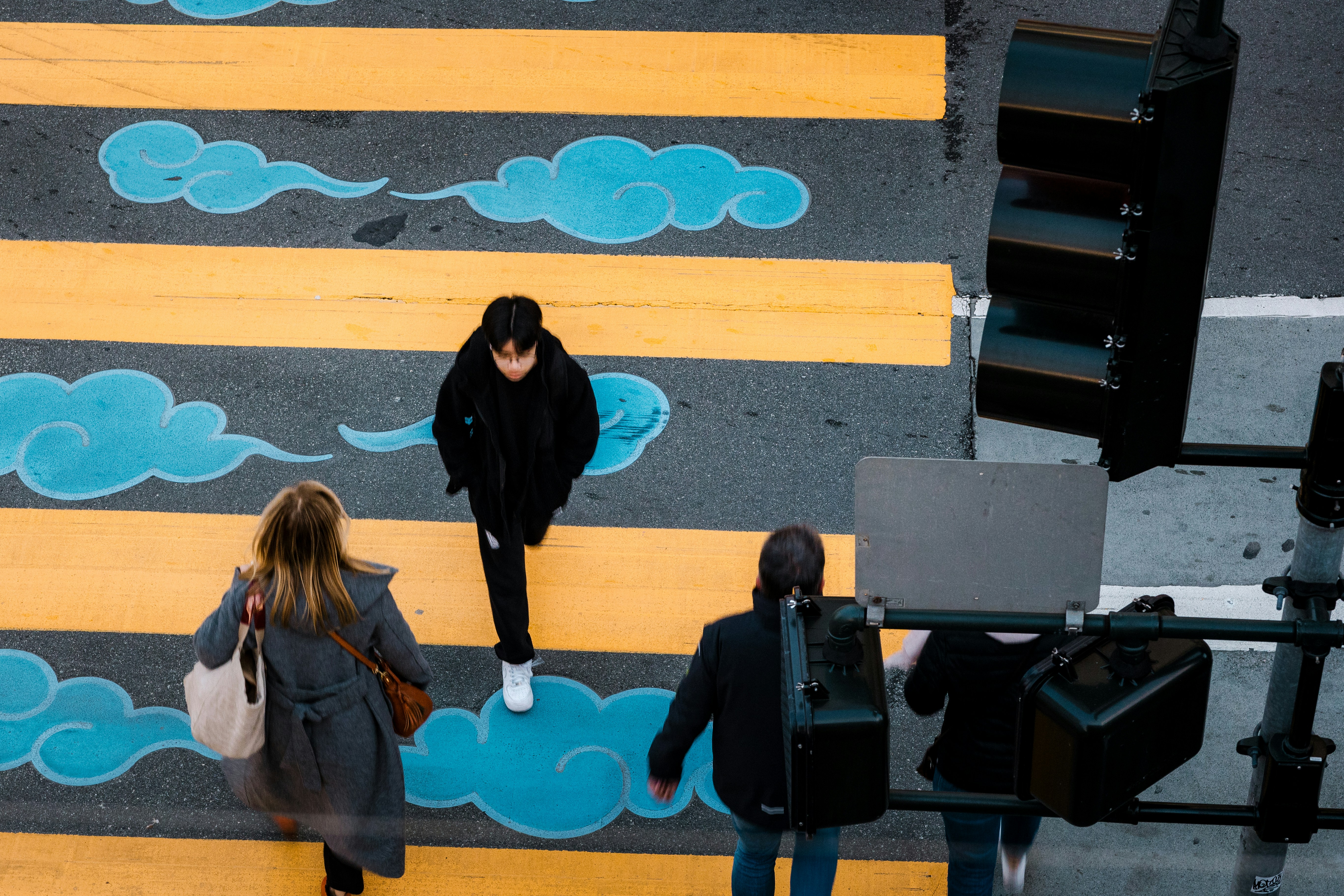 a couple of people that are standing in the street