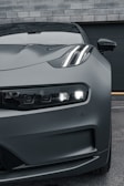 the front end of a gray sports car