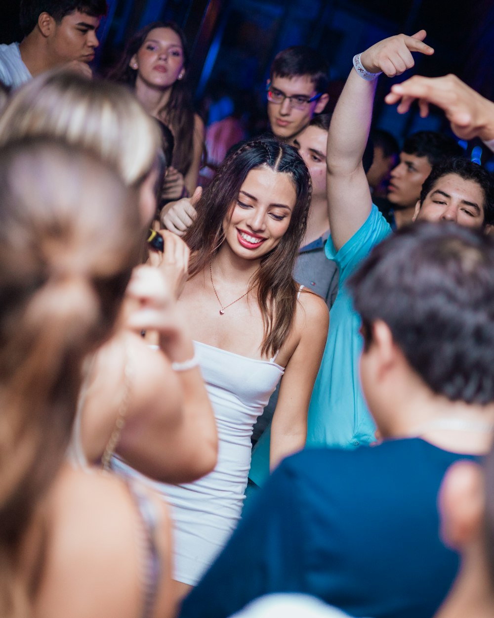 a group of people dancing at a party