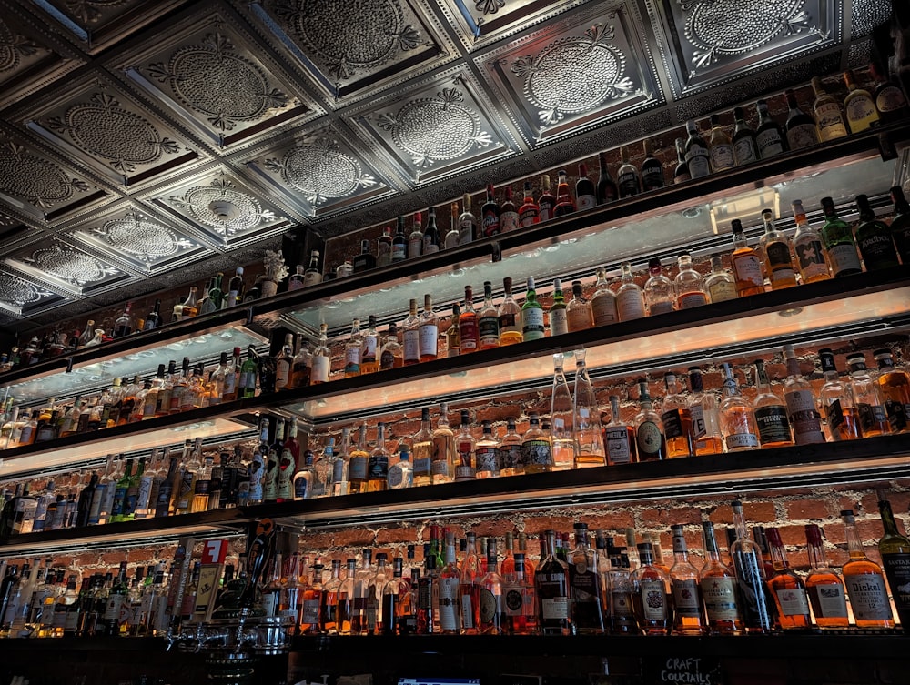 a bar filled with lots of bottles of liquor