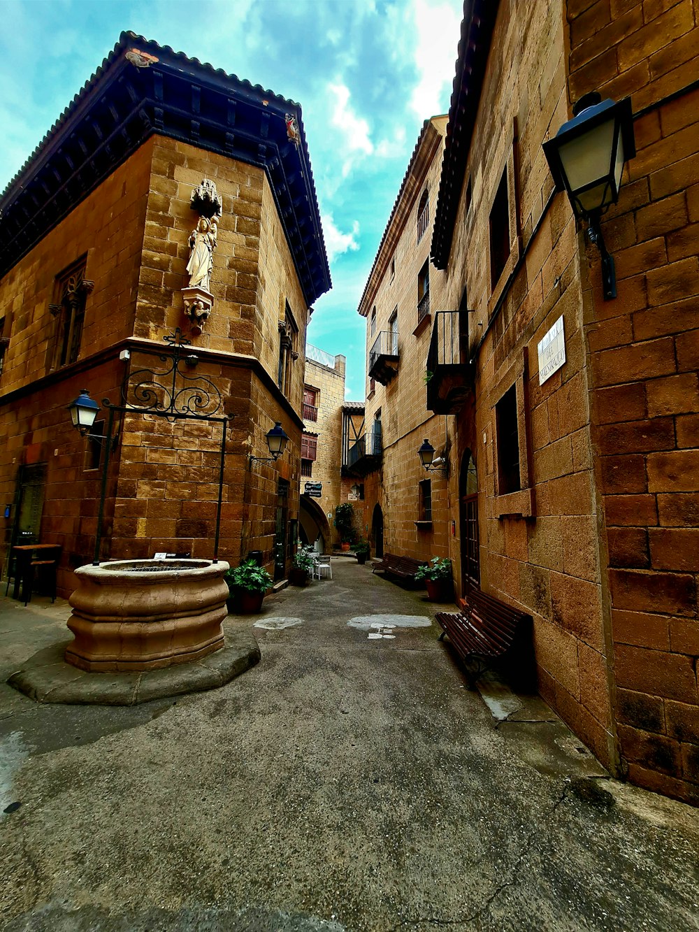 a street with a fountain in the middle of it