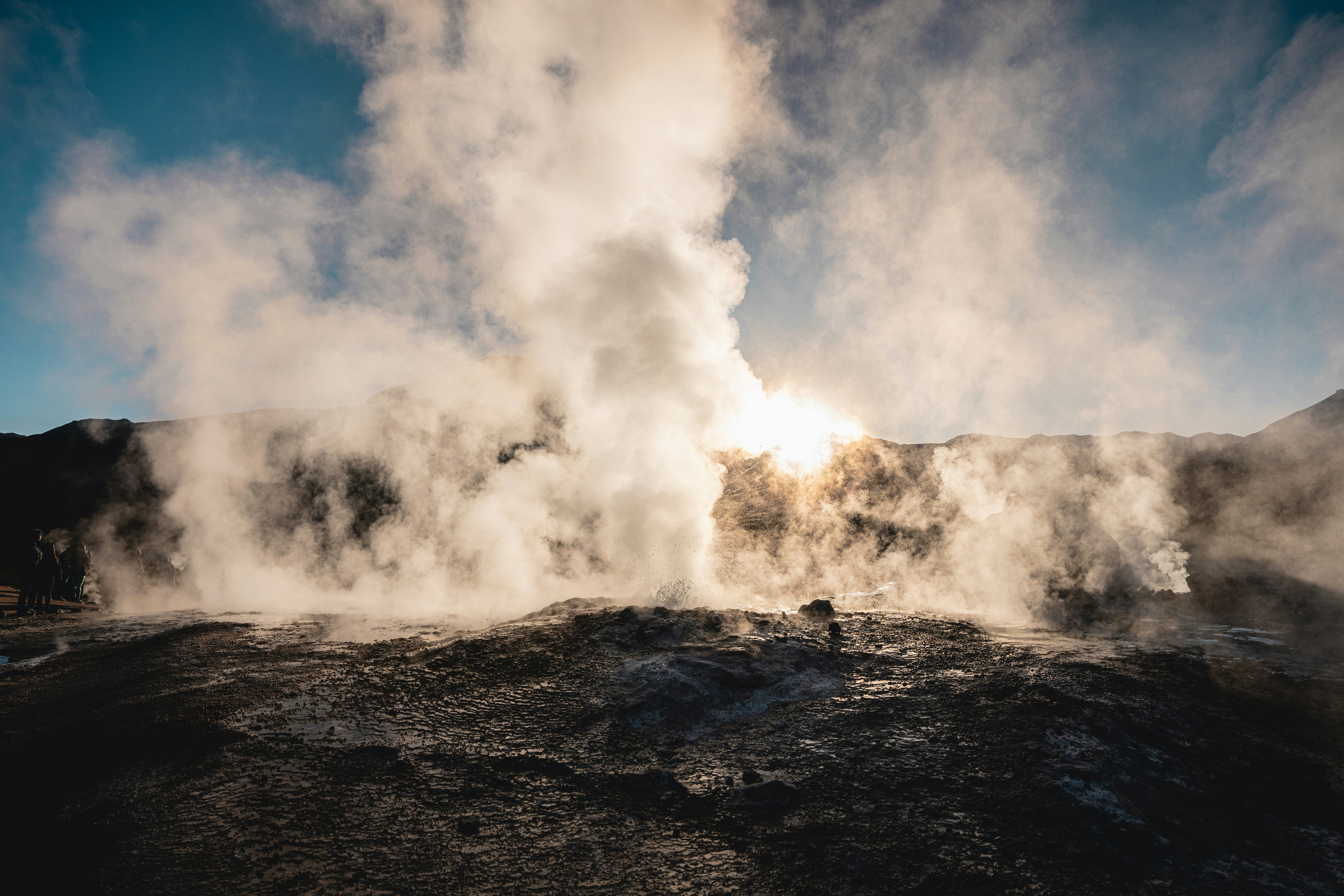 a geyser spewing out steam into the air
