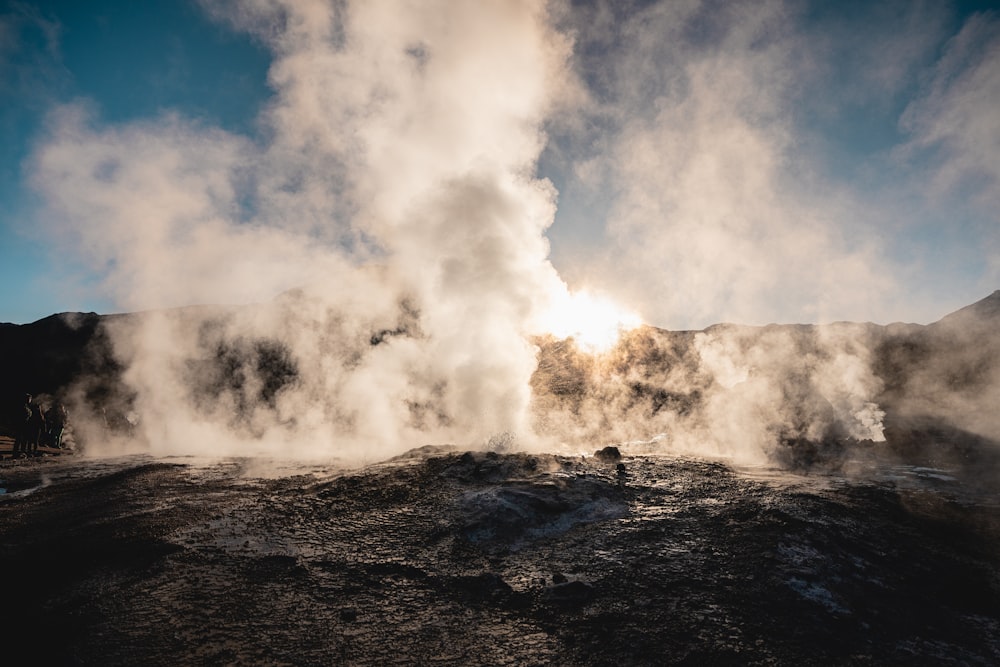 a geyser spewing out steam into the air