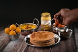 a plate of food on a wooden table