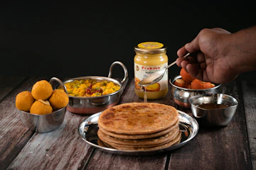 a plate of food on a wooden table