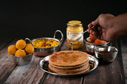 a plate of food on a wooden table