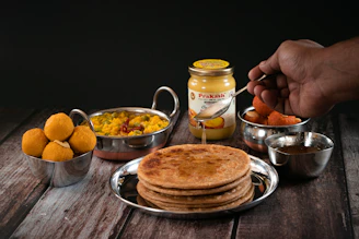 a plate of food on a wooden table