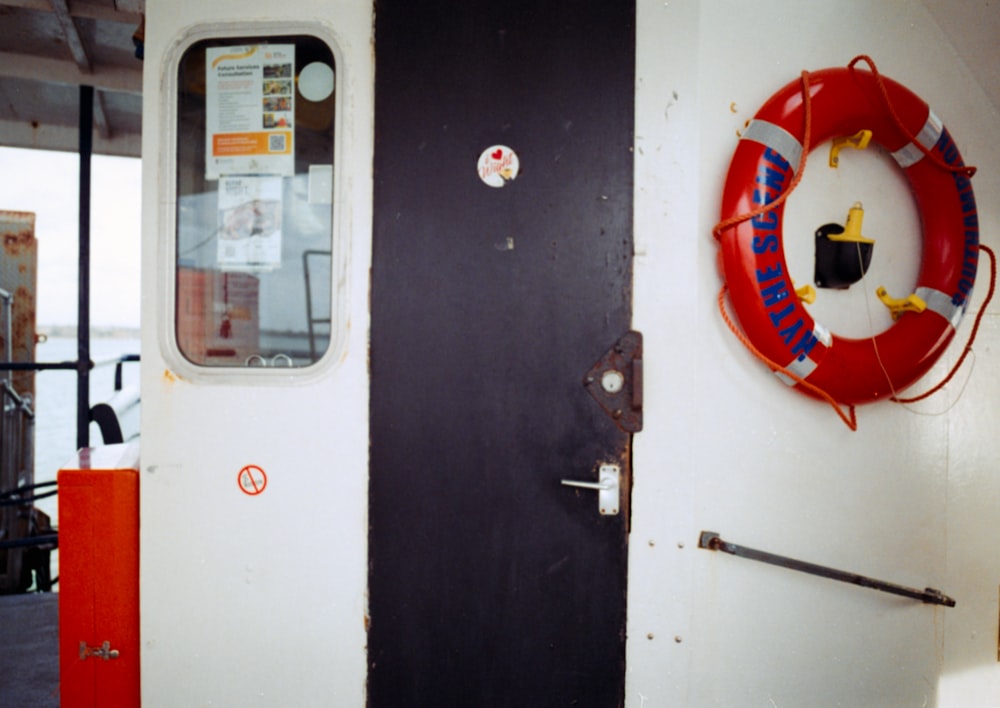 a door with a life preserver hanging on it