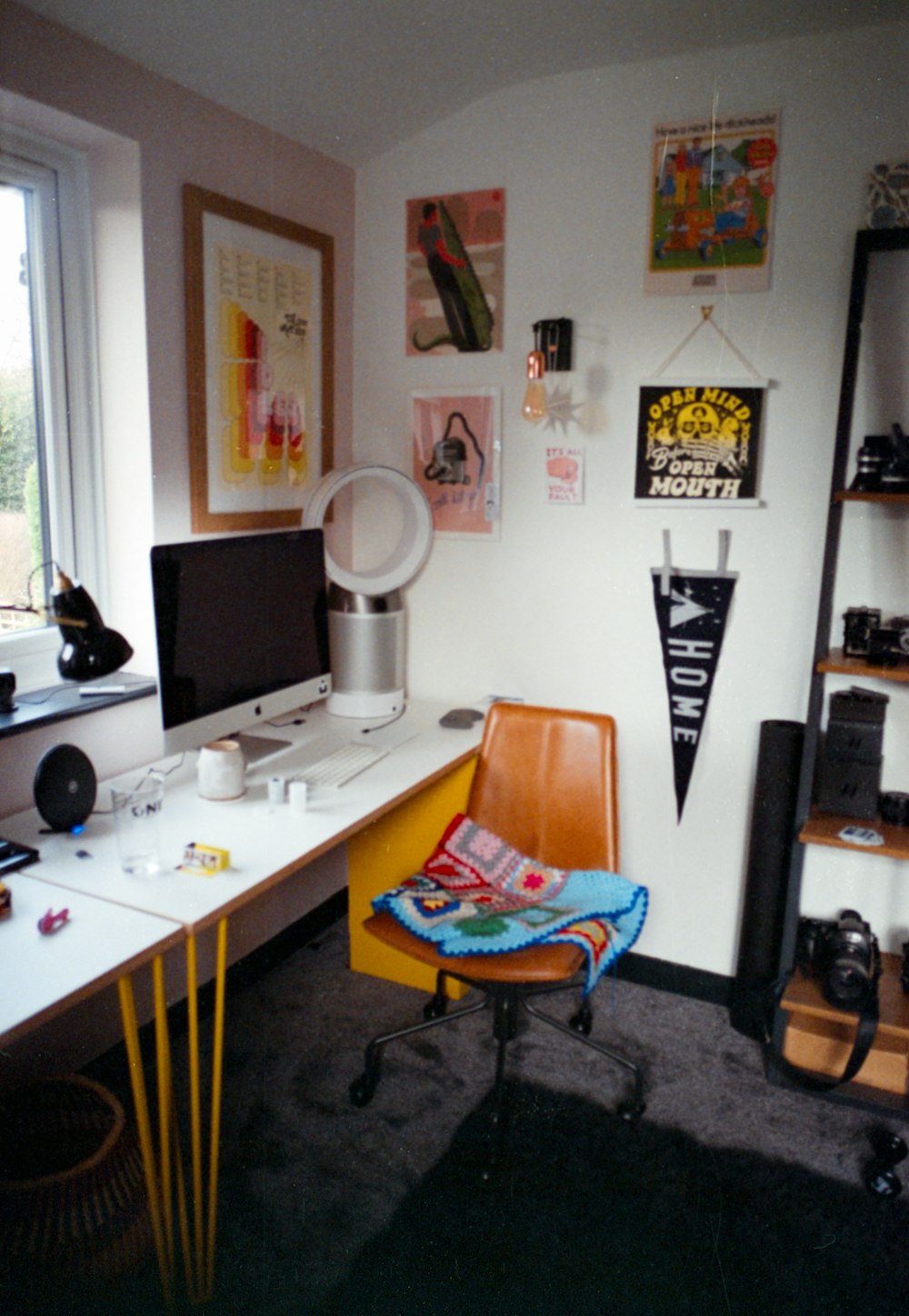 a room with a desk and a chair in it