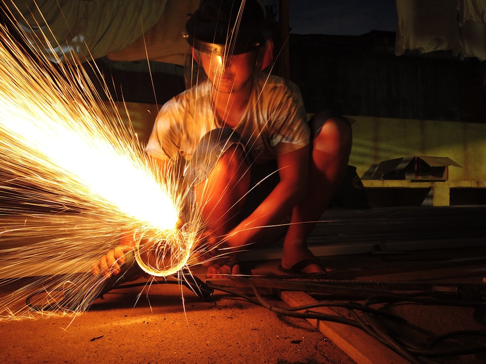 a man working on a piece of metal