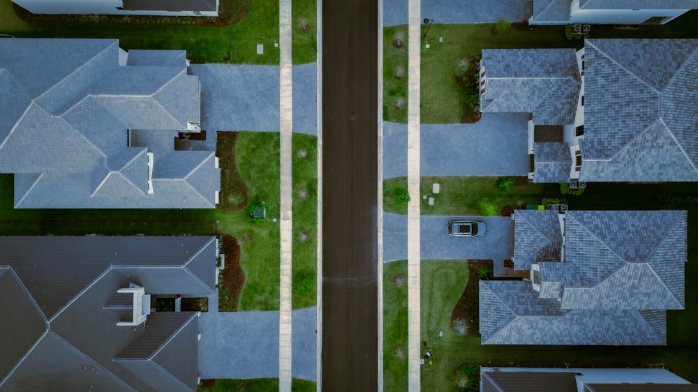 aerial view of two houses in a neighborhood