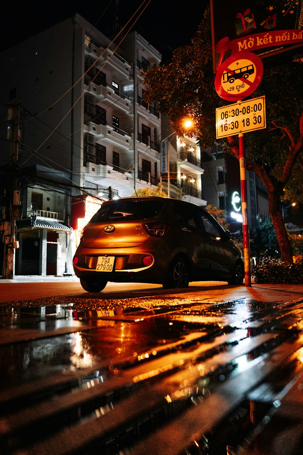 a car parked on the side of the road at night