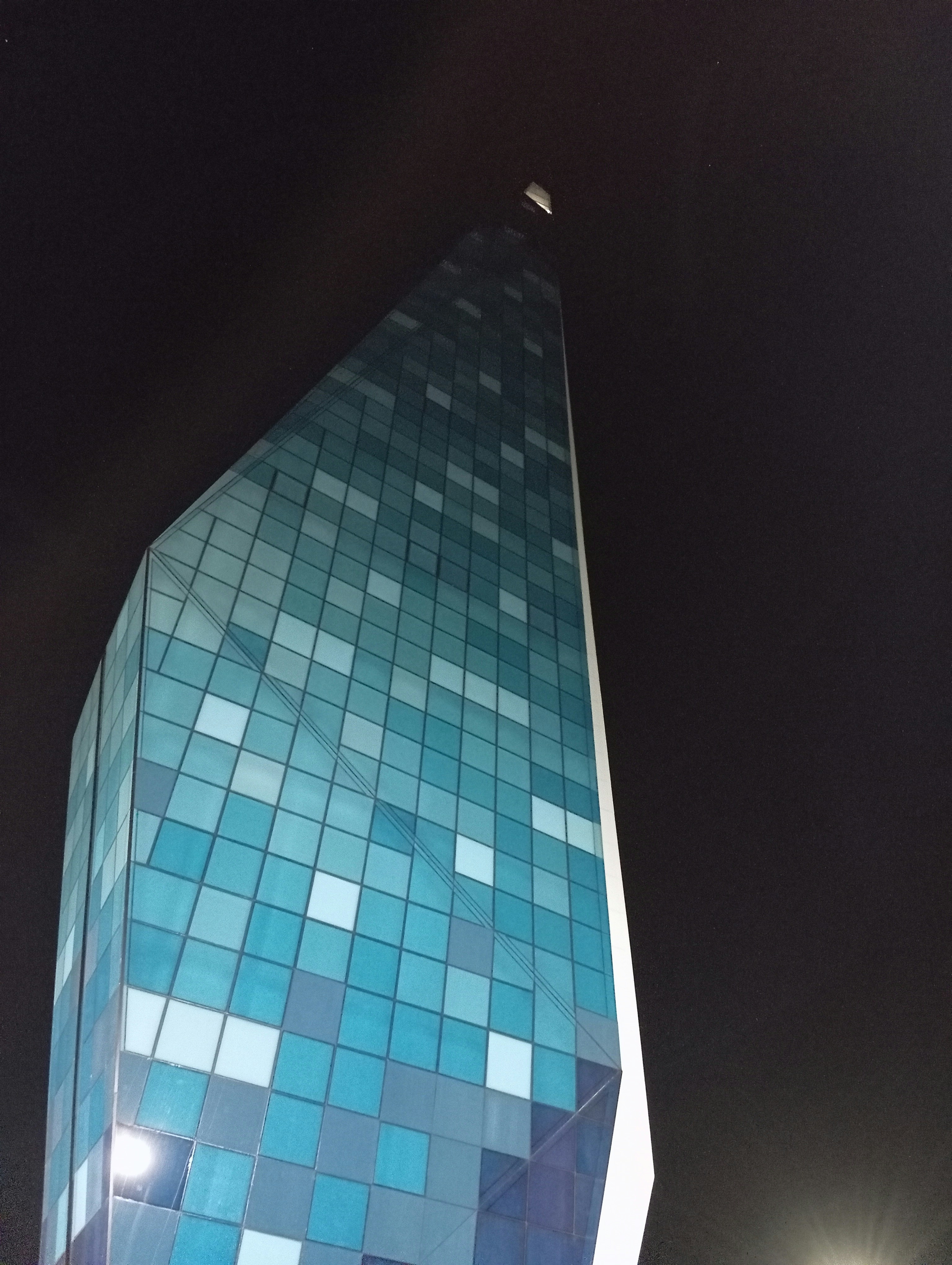 a very tall building with a clock on it's side