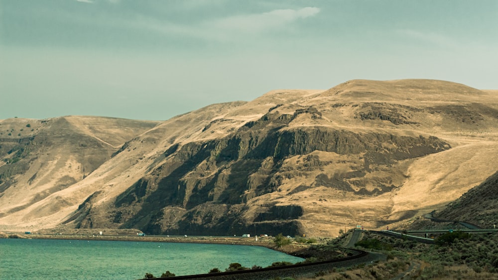 a scenic view of mountains and a body of water