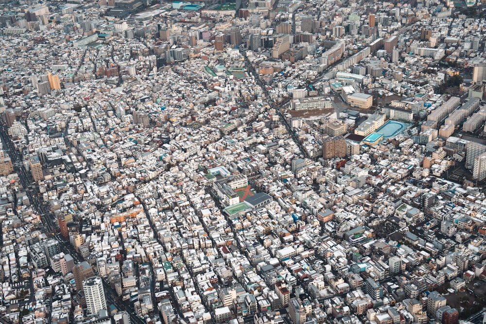 an aerial view of a city with lots of tall buildings