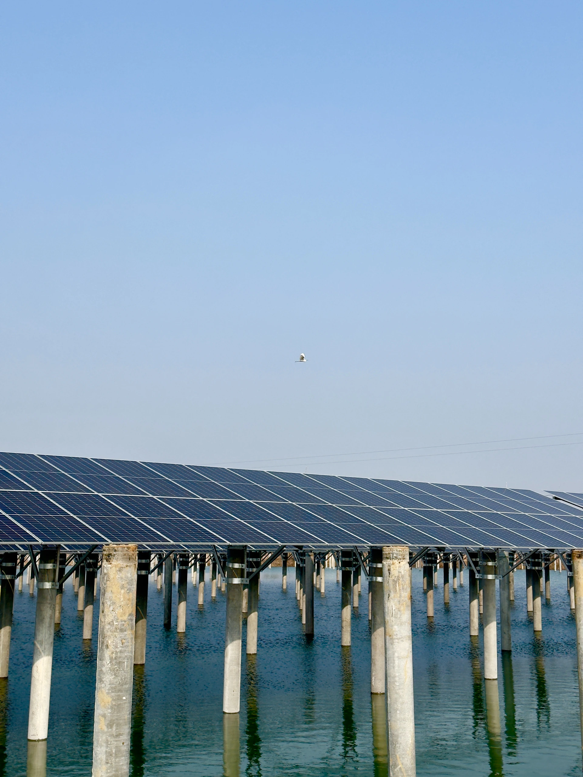 a solar panel on top of a large body of water