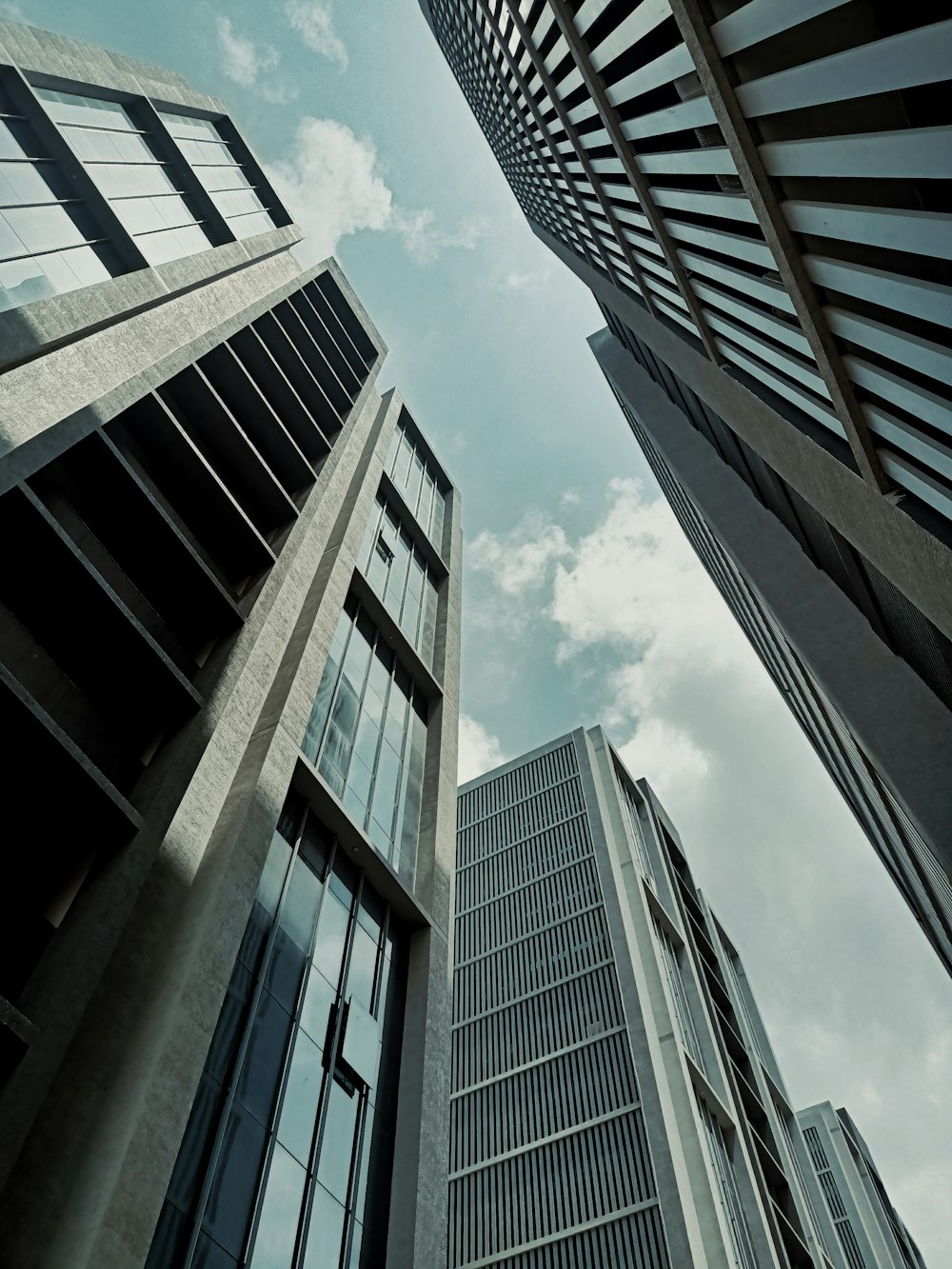 looking up at tall buildings in a city