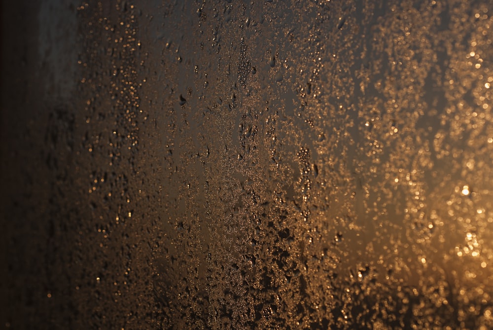 a close up of a window with rain drops