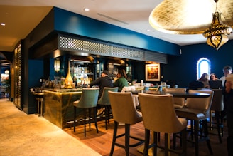 a group of people sitting at a bar