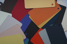 a pile of different colored tags and tags