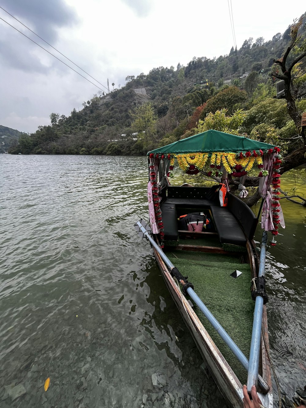 a small boat with bananas on it is in the water