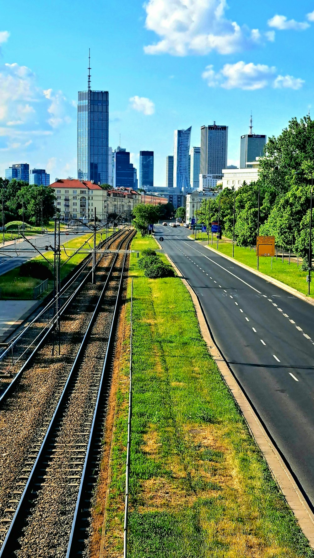 a view of a city from a train track