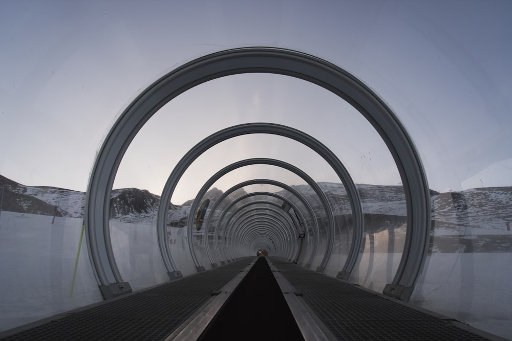 a long tunnel with snow on the ground