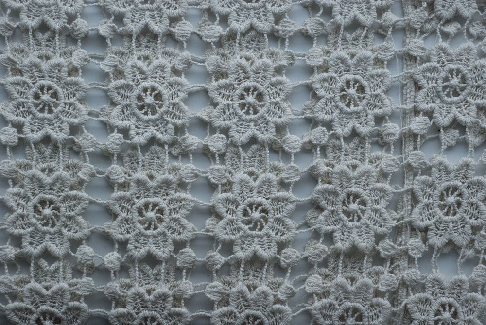 a close up of a white crocheted fabric