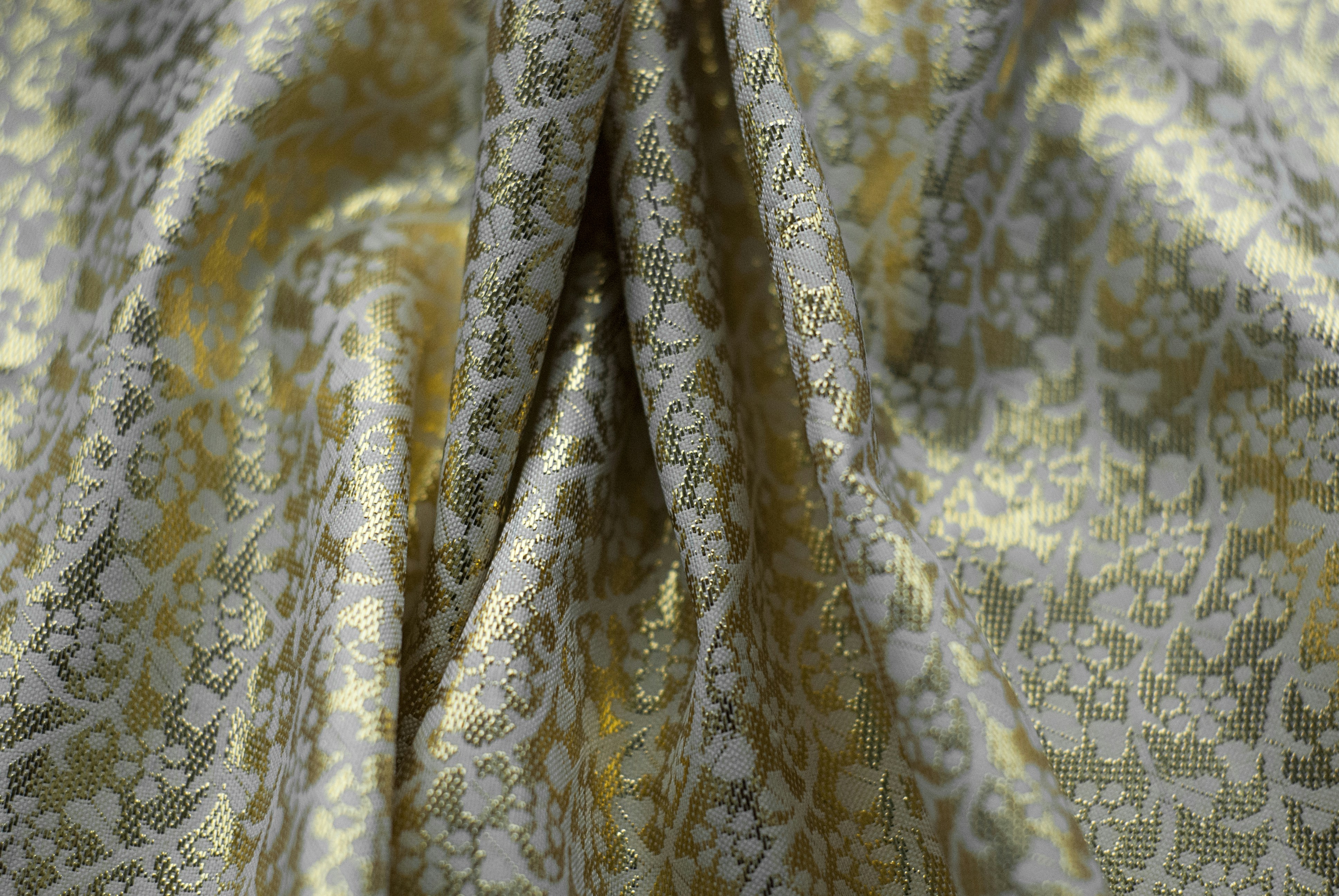a close up of a yellow and white fabric