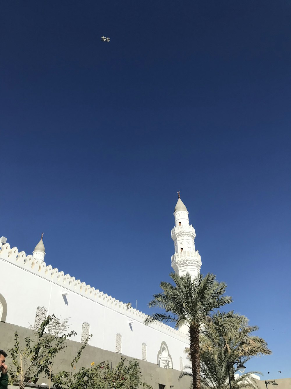 a large white building with a clock tower