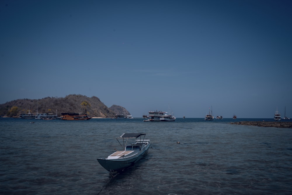 a small boat floating on top of a body of water