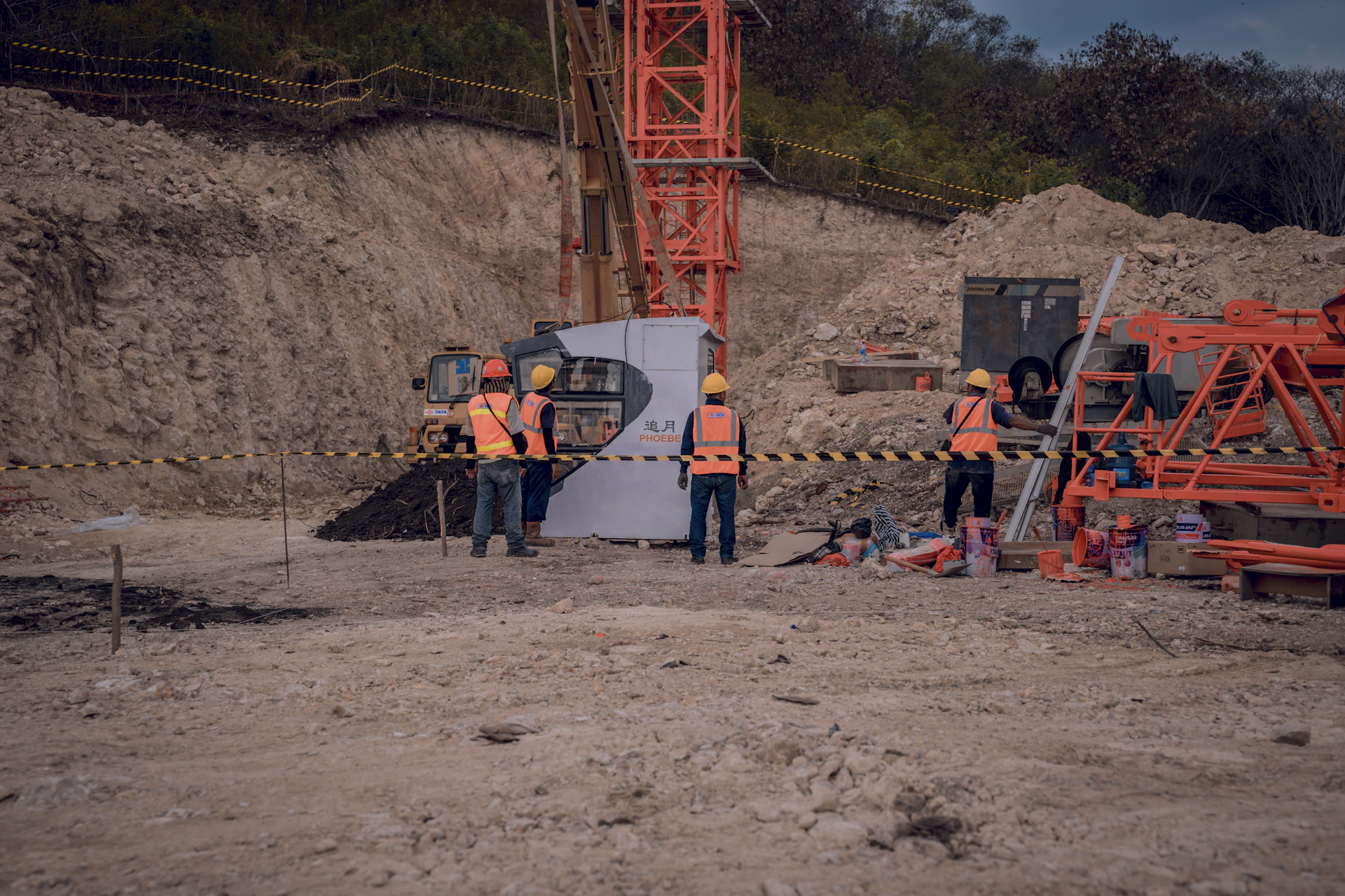 a group of men standing around a construction site