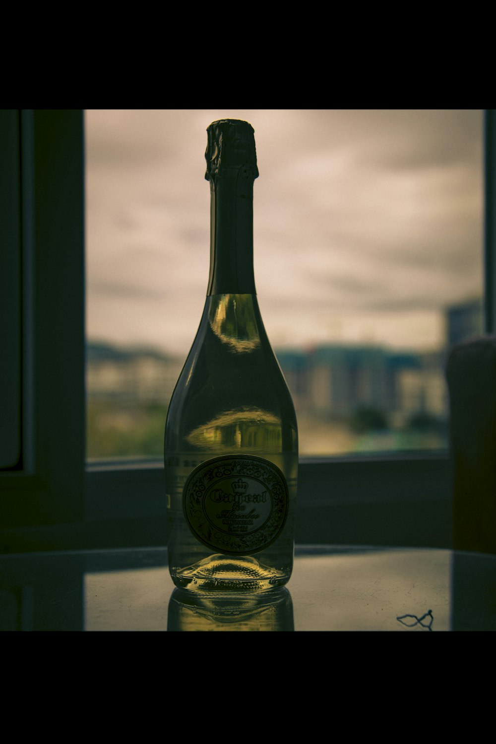 a bottle of wine sitting on top of a table