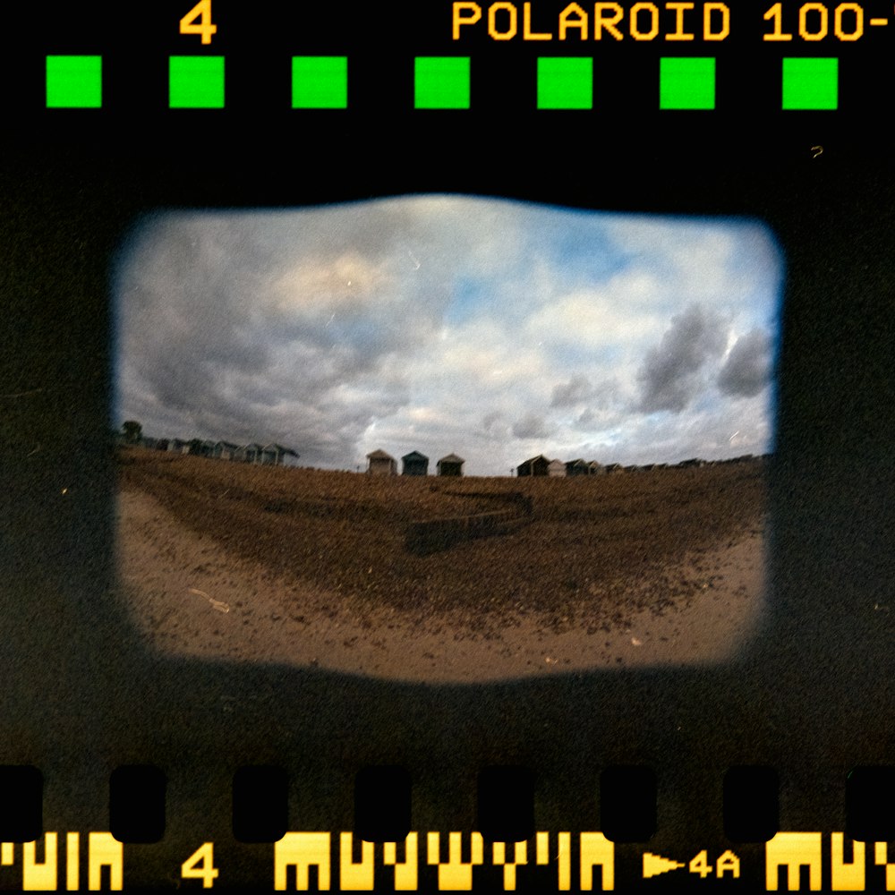 a view of a field through a hole in a camera