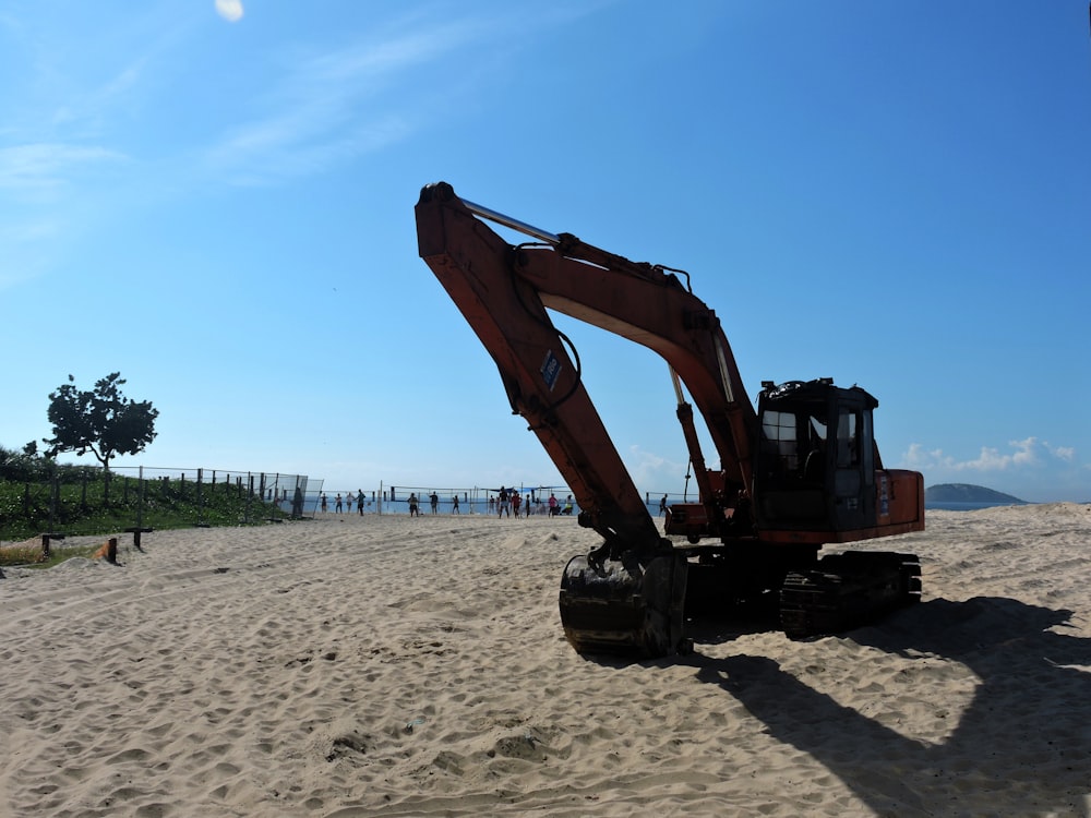 a construction vehicle is parked on the beach