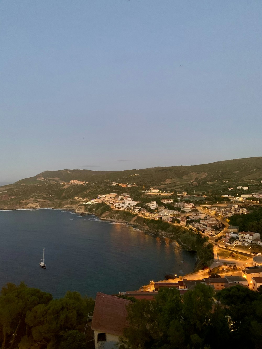 a view of a town and a body of water