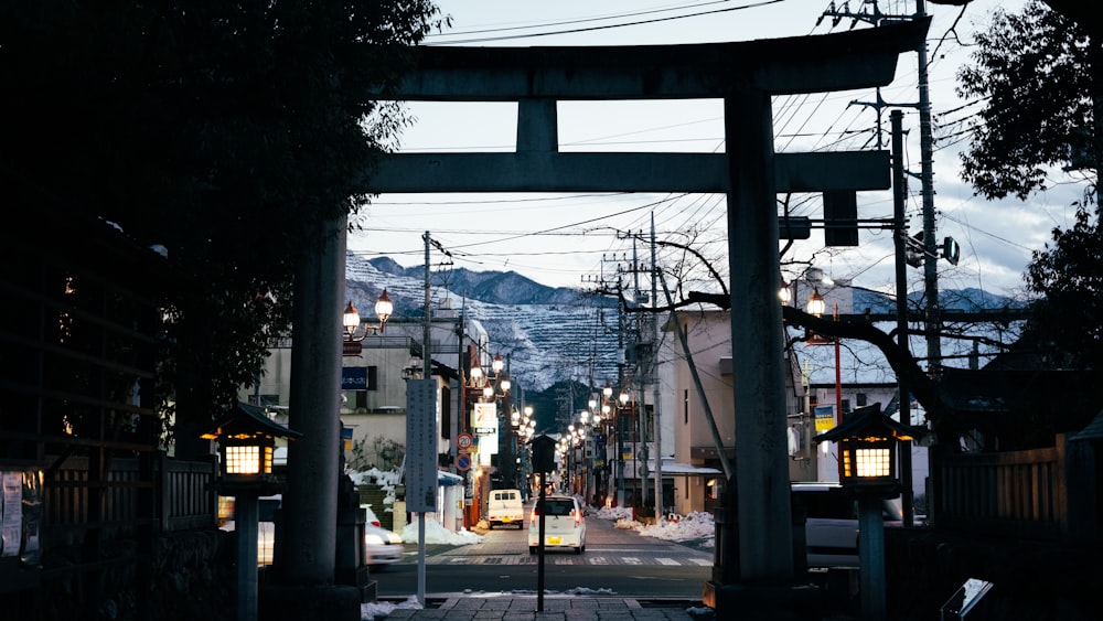 a view of a city street with a mountain in the background