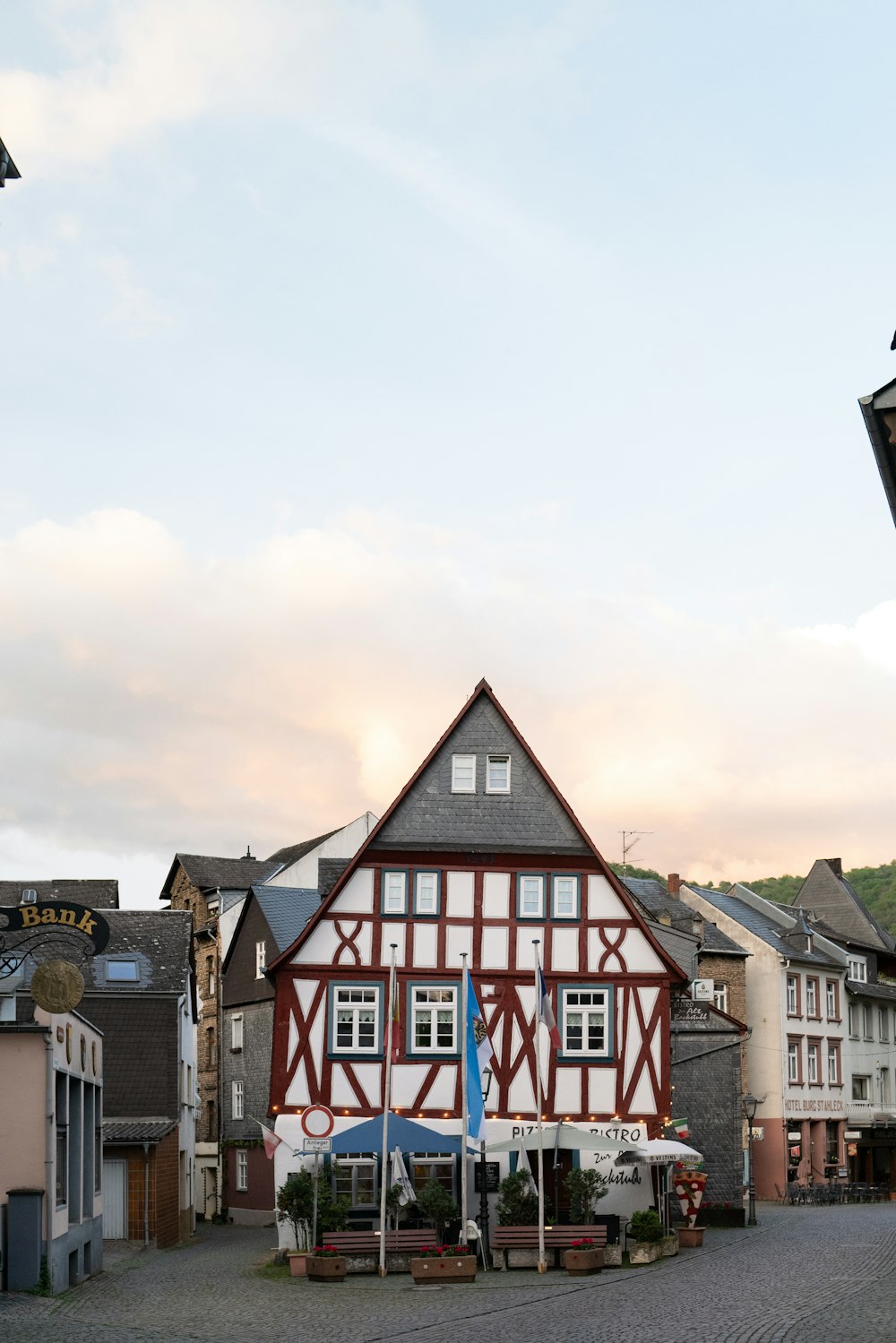 a red and white building sitting on the side of a road