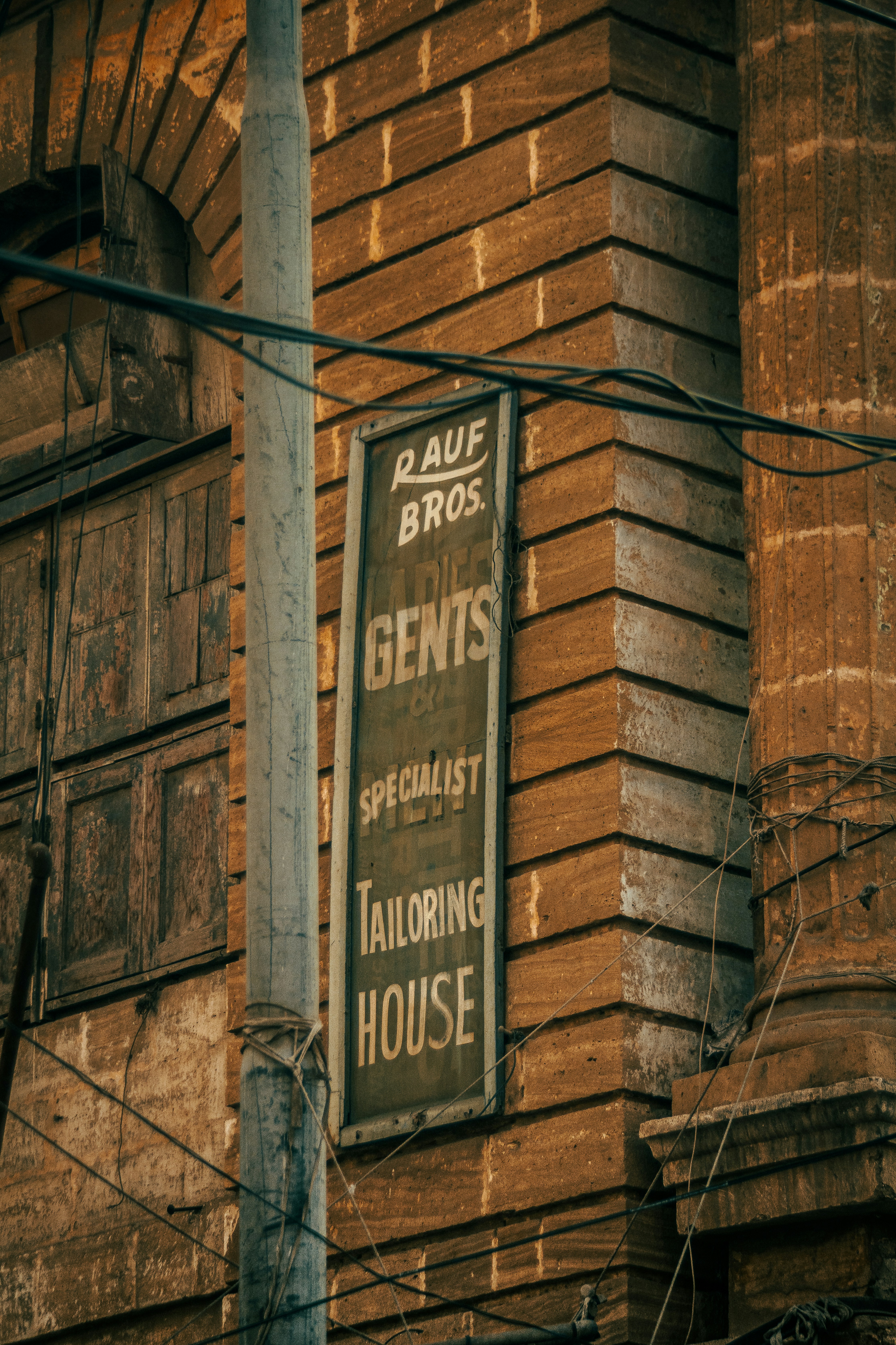 a sign on a pole in front of a building