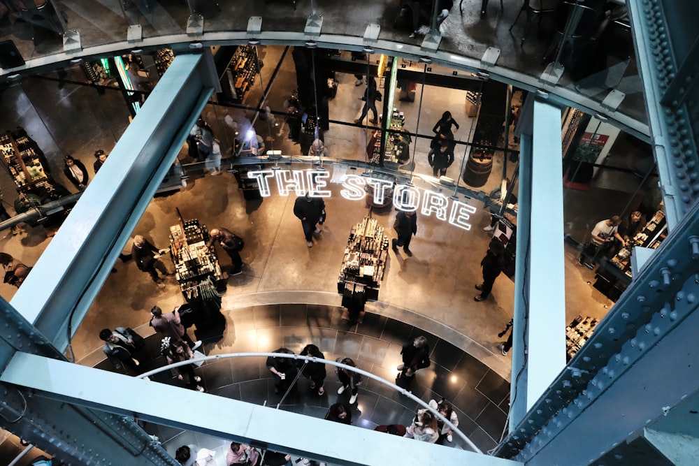 a group of people standing around a store