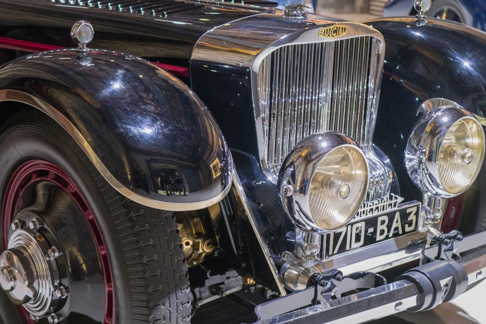 a close up of the front of a classic car