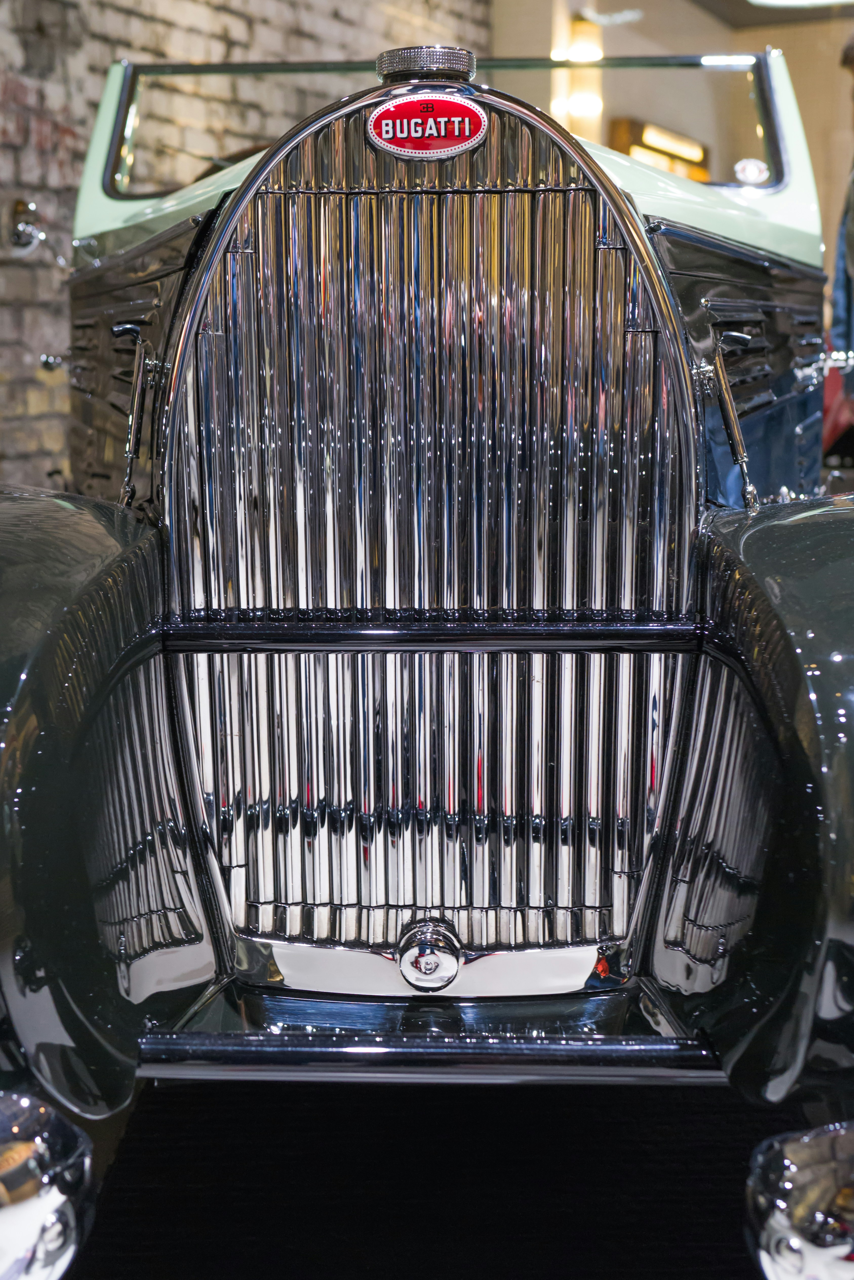 an old car with a birdcage on the front of it