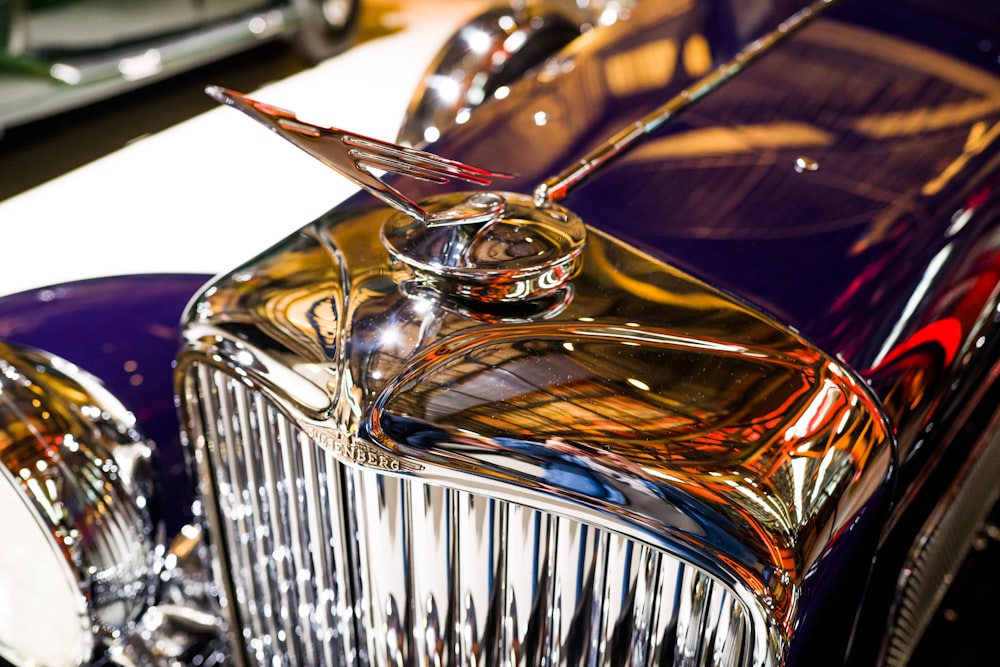 a close up of the front of a classic car