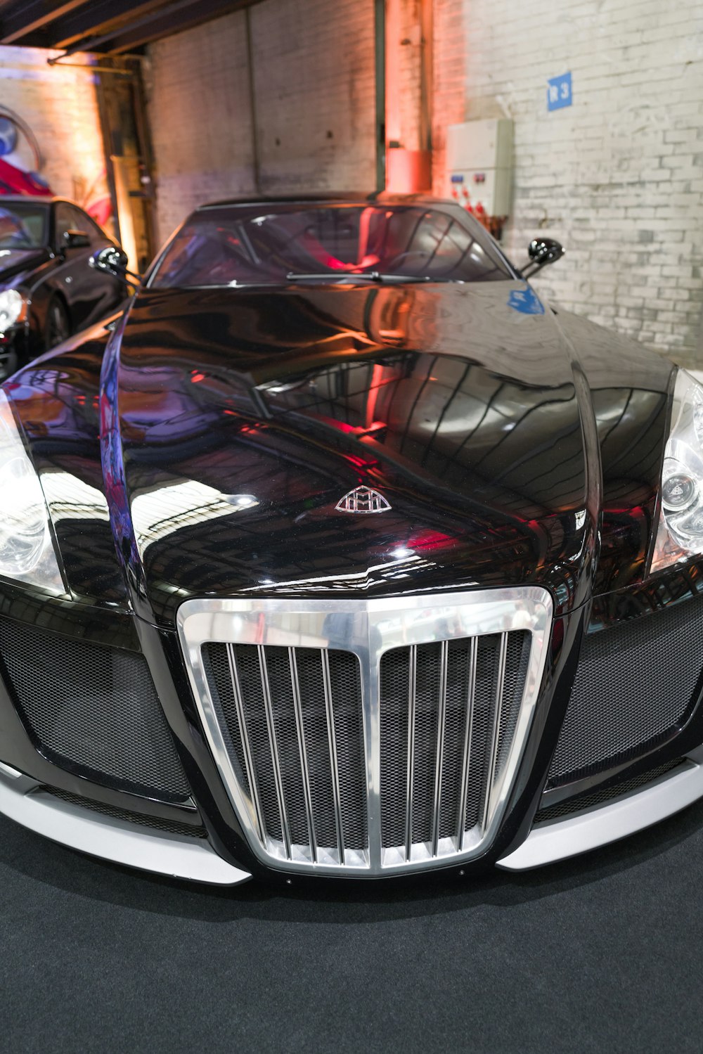 a black sports car parked in a garage